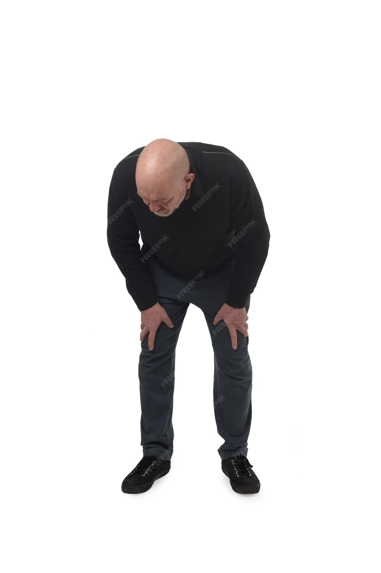 Premium Photo | Front view of a man crouched down and looking down on