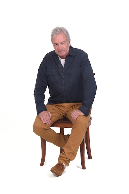 Front view of a man sitting on chair on white background