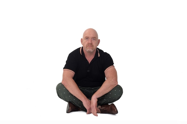 Front view of man sitting on floor on white backgound