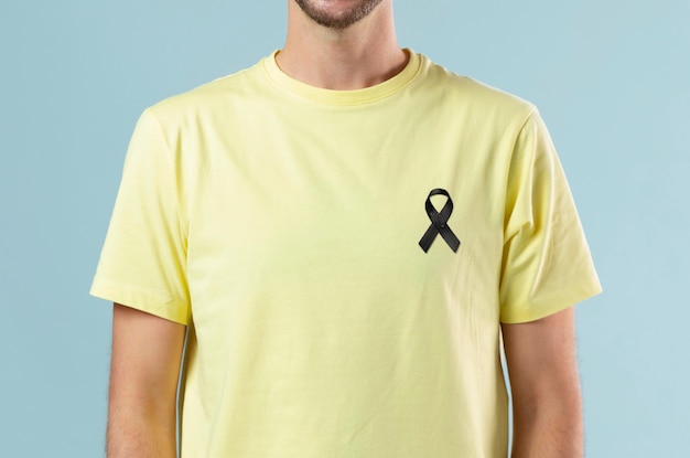 Front view man wearing black mourning ribbon