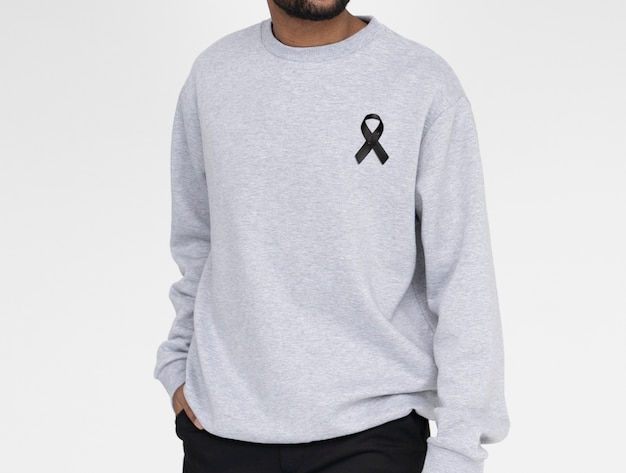 Front view man wearing black mourning ribbon