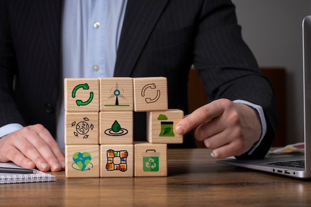 Photo front view man with wooden blocks