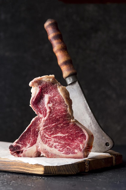 Photo front view meat with cleaver high quality and resolution beautiful photo concept