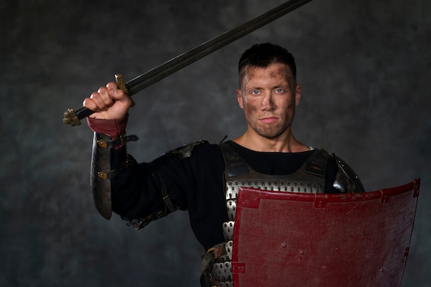 Front view medieval soldier posing in studio