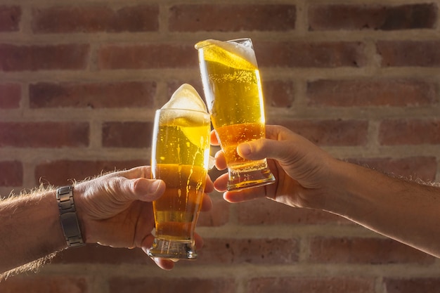 Front view men cheer with beer glass