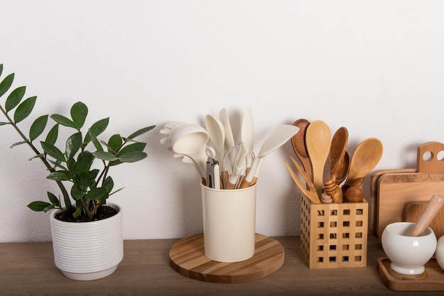 Front view of a modern kitchen countertop with homemade cooking\
utensils made of eco materials the concept of cooking healthy\
food