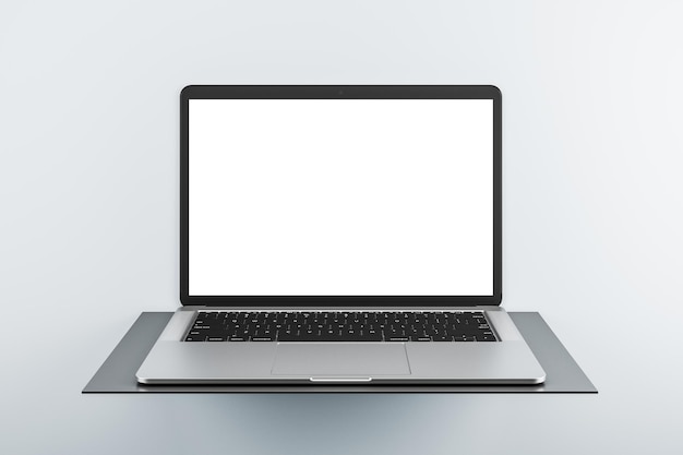 Front view on modern laptop blank white screen with copyspace for your logo or text on dark stand isolated on light background 3D rendering mock up