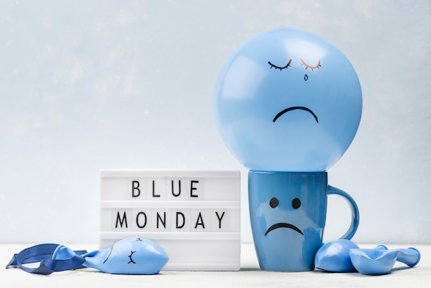 Photo front view of mug with frown for blue monday