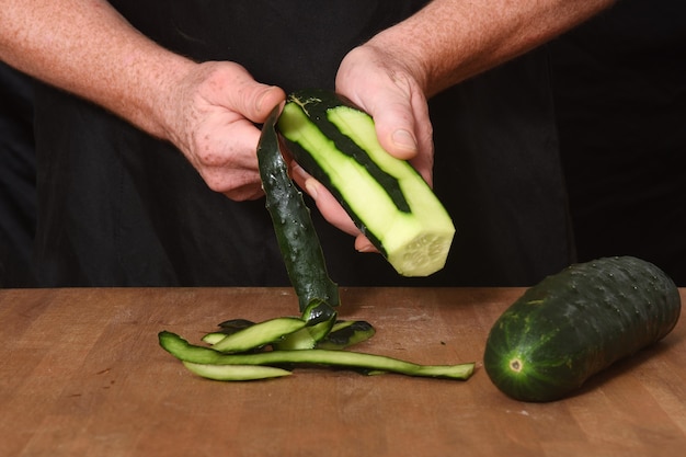 Front view of a peeled pepper on a wood