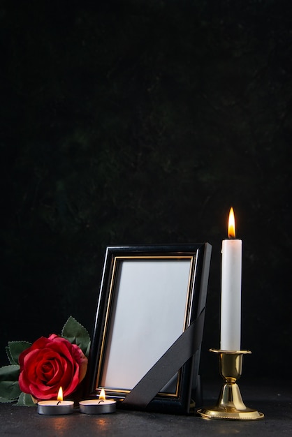 Front view of picture frame with red flower on black