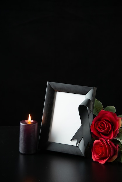 Front view of picture frame with red flowers on black