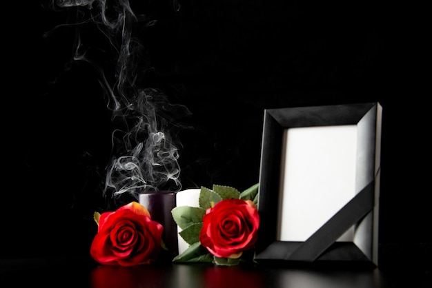 Front view of picture frame with red flowers on black