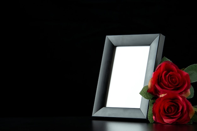 Front view of picture frame with red rose on black