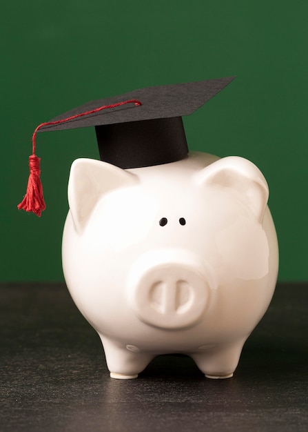 Front view of piggy bank with academic cap