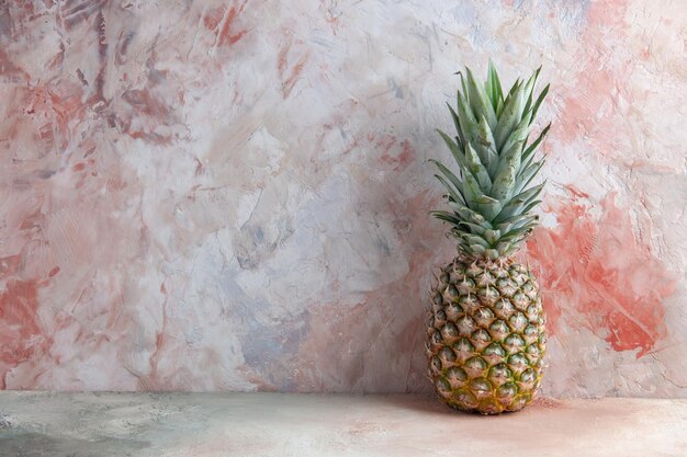 front view pineapple fruit on beige background with free space