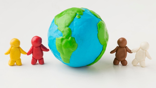 Front view of plasticine people with globe