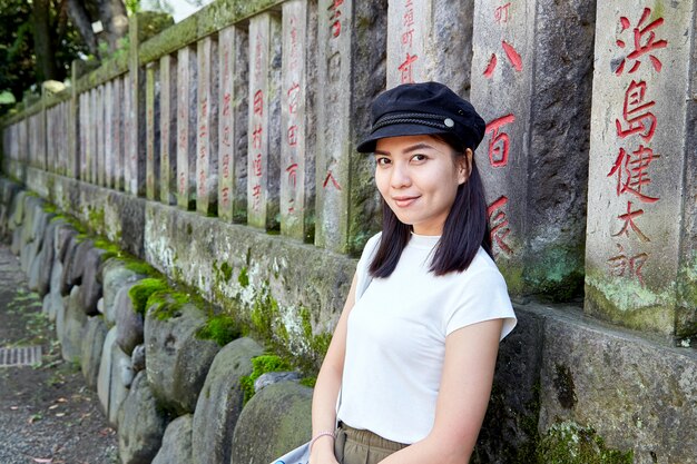 Front view portrait of a happy woman tourist