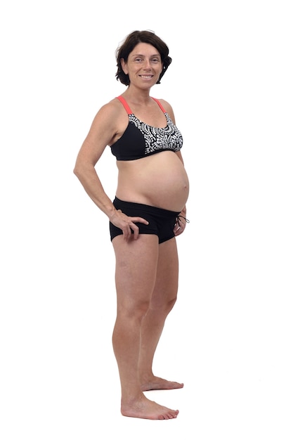 Front view of a pregnant woman with swimsuit on white background