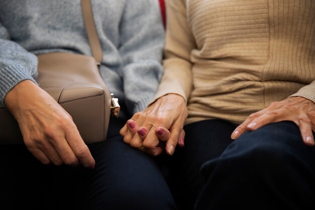 Front view queer couple holding hands