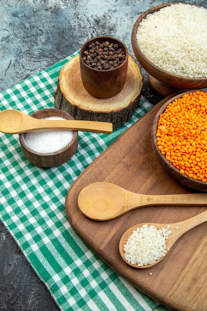 front view raw rice with orange lentils on dark background food meal groats soup color cereal