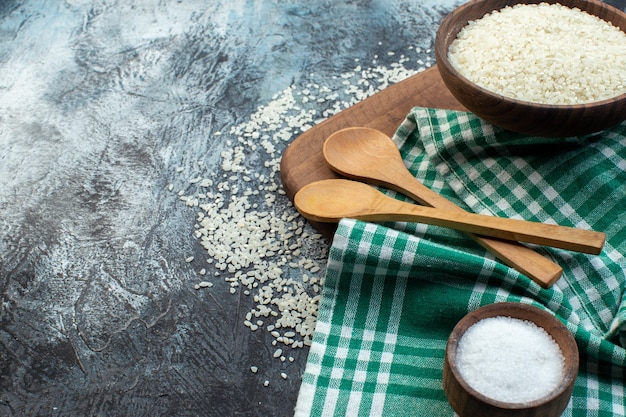 front view raw rice with seasonings on dark background cereal color soup food meal seed groats