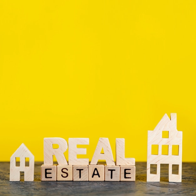 Front view real estate lettering on yellow background