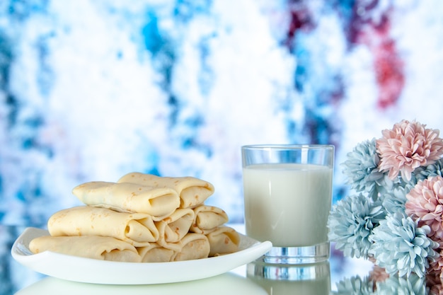 front view rolled sweet pancakes with glass of milk on light background meal breakfast food sugar flower color cake morning pie