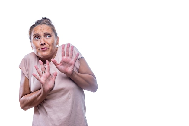 Front view of a scared green-eyed woman on a white background with copy space.