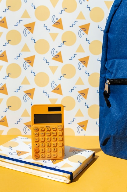 Photo front view school supplies on the table assortment