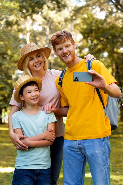 Front view smiley family taking selfie