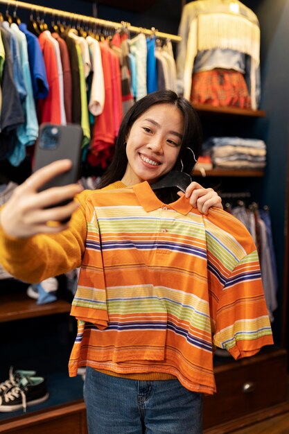 Front view smiley woman taking selfie