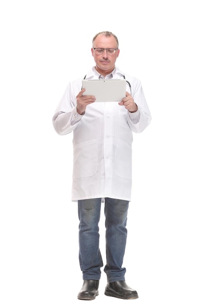 Front view of smiling doctor with tablet computer. Isolated over white background. Concept of health care.