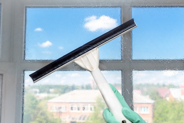 front view window cleaning with a squeegee