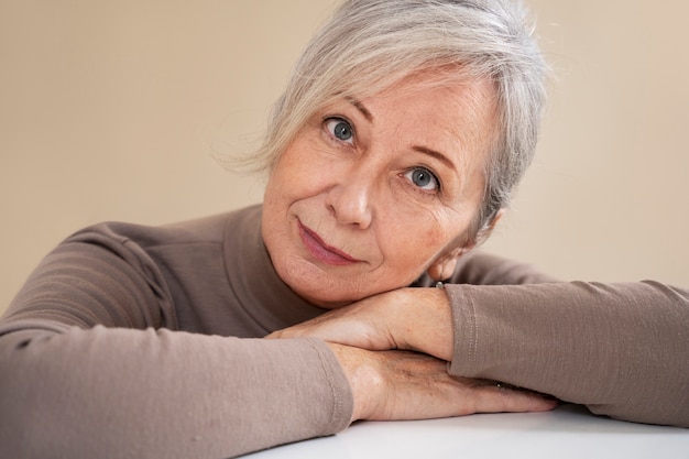 Front view wise woman posing indoors