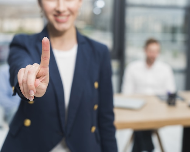 Front view of woman from human resources putting her finger up