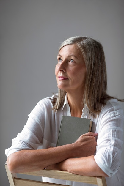 Front view woman holding book