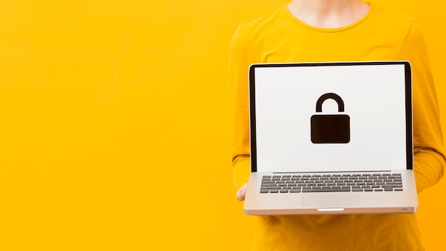 Photo front view of woman holding laptop with lock and copy space