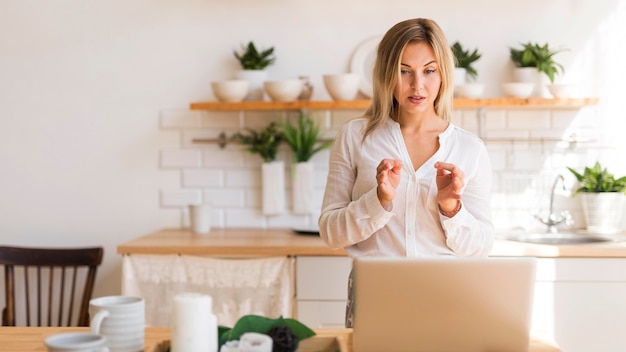 Front view woman at online meeting