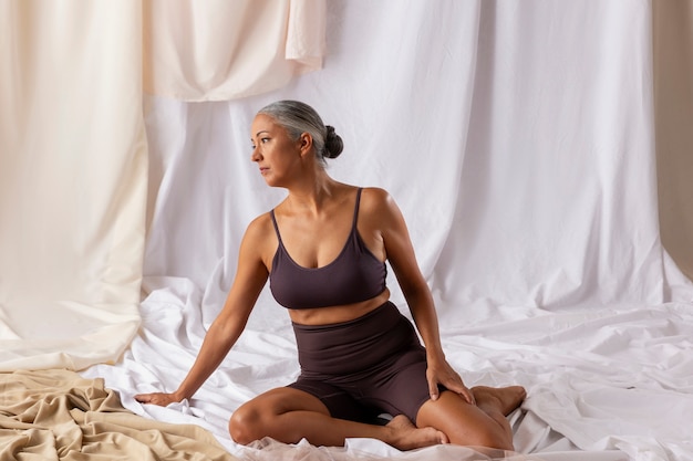 Front view woman sitting on floor