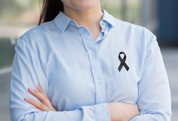 Front view woman wearing black mourning ribbon