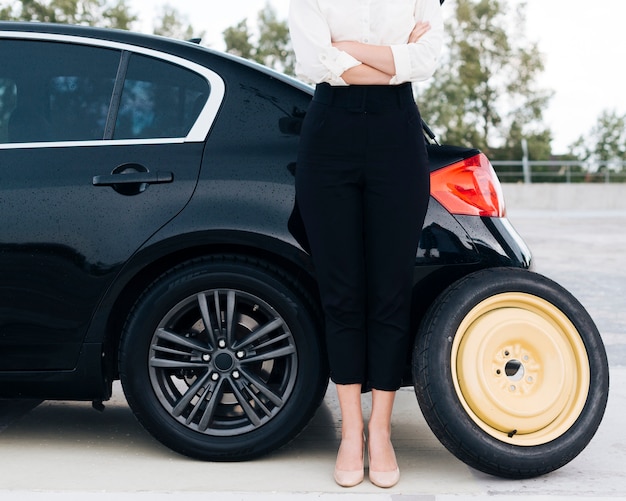 Front view of woman with spare tire