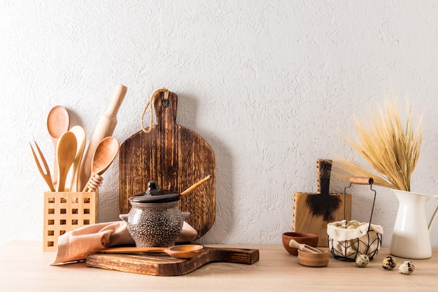 Front view of the wooden countertop of a modern country house\
cottage environmentally friendly kitchen utensils without\
plastic