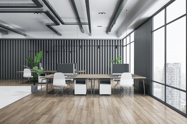 Front view on wooden tables with modern computers white chairs on wooden floor grey metallic decorative wall and city view from big windows in open space office 3D rendering