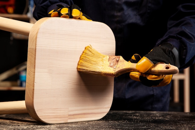 Front view worker holding brush