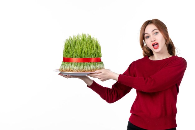 front view young female holding big novruz semeni on white background ethnicity family performer colours spring holiday ethnic