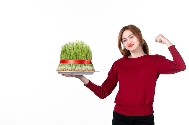 front view young female holding big novruz semeni on white background ethnicity family performers colours spring holiday ethnic concept