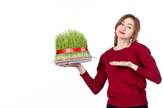 front view young female holding big novruz semeni on white background ethnicity family spring holiday colours ethnic concept