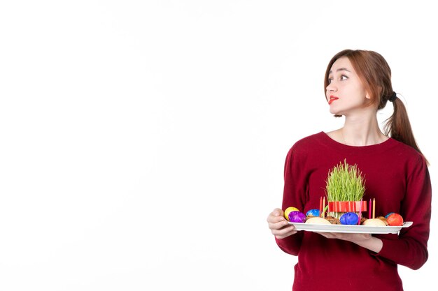 front view young female holding honca with semeni and novruz sweets on white background ethnic performer colours family concept spring holiday