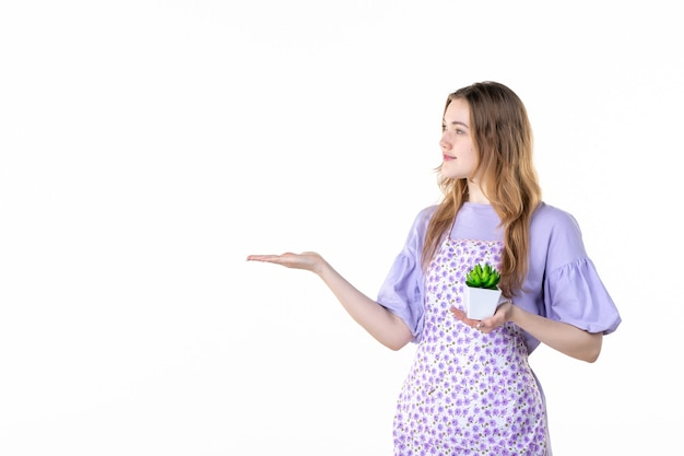 front view young female holding little green plant on white background leaf plant green job flower garden grass houseplant woman