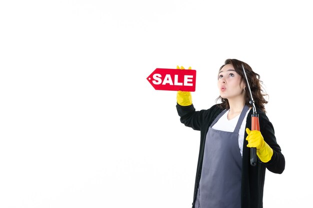 front view young female holding red sale writing and secateurs on the white background garden tree flower job color nature grass gardener